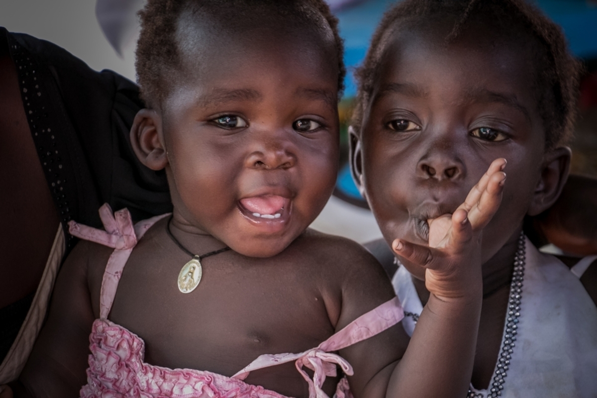 Two young girls attend an MSF clinic in Palorinya refugee camp, Uganda. There is very little healthcare provision in parts of the camp so MSF are setting up clinics to address the healh needs of the growing poulation.
