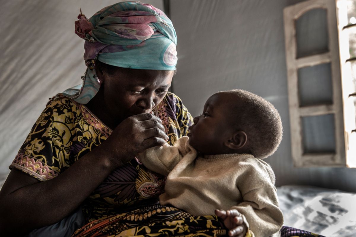 A mother and her child in the Katana CTC. Before MSF set up the centre, cholera treatment cost around US$35. Many patients from rural areas around Katana struggled to pay this and therefore had to wait to receive treatment.